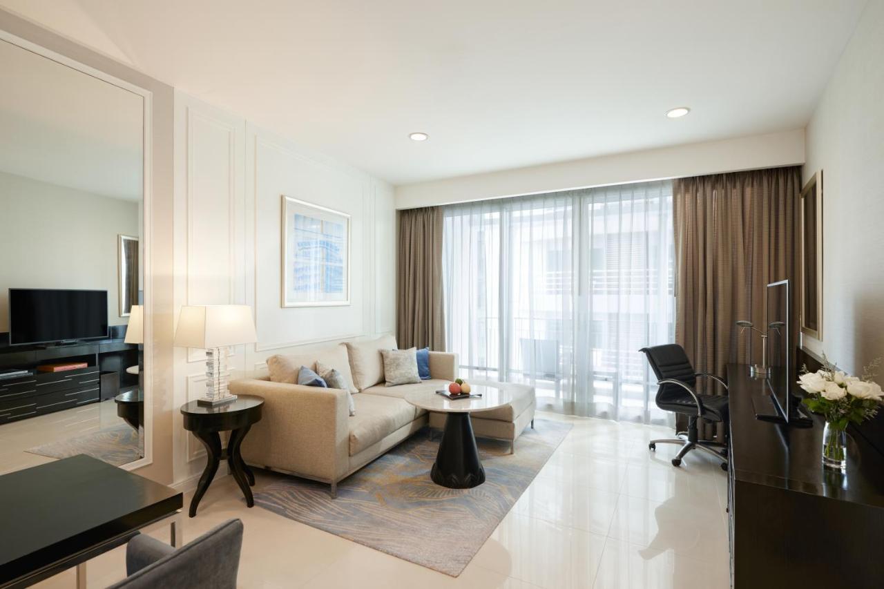 Dusit Suites Hotel Ratchadamri, Bangkok Dış mekan fotoğraf A living room in a serviced apartment in Singapore